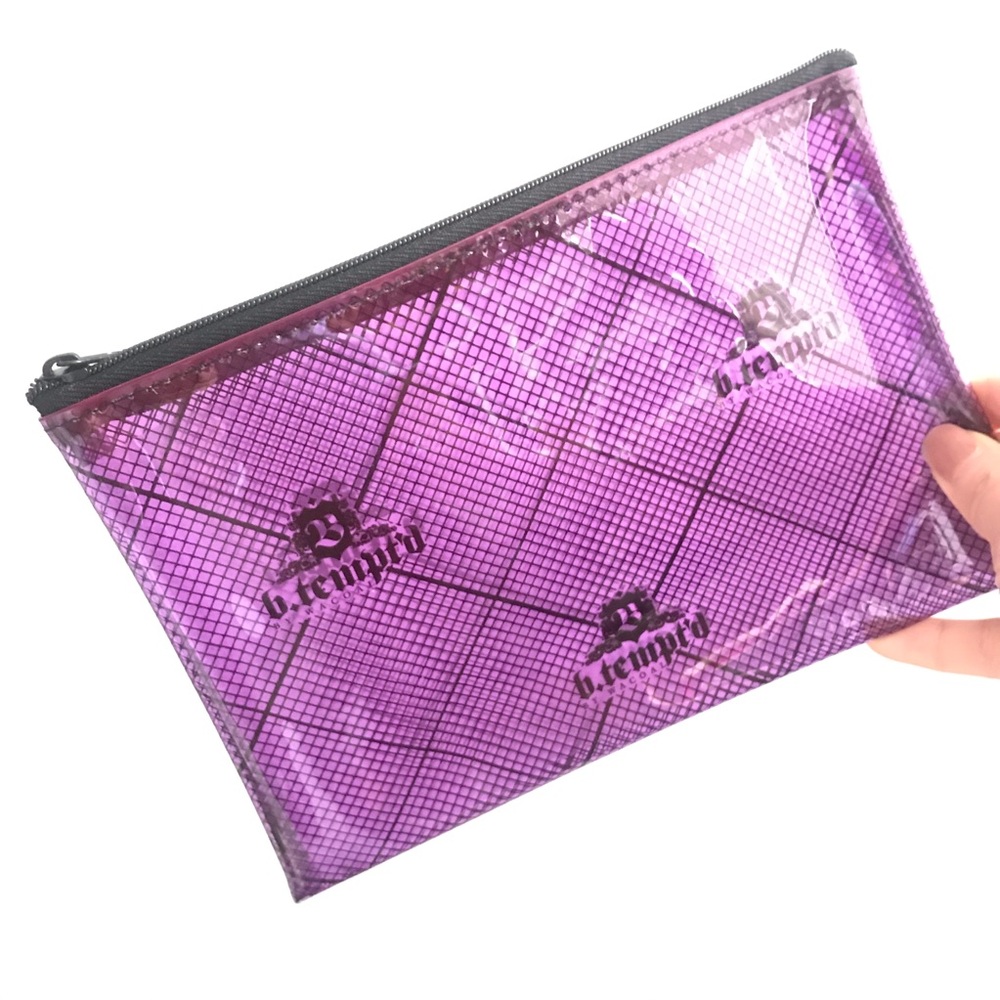 Flexible purply-pink tinted transparent pouch